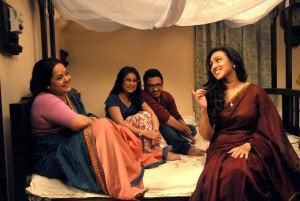 Aparajita Auddy, Monami, Anindya Chatterjee, Rituparna Sengupta in a scene from Belaseshe.